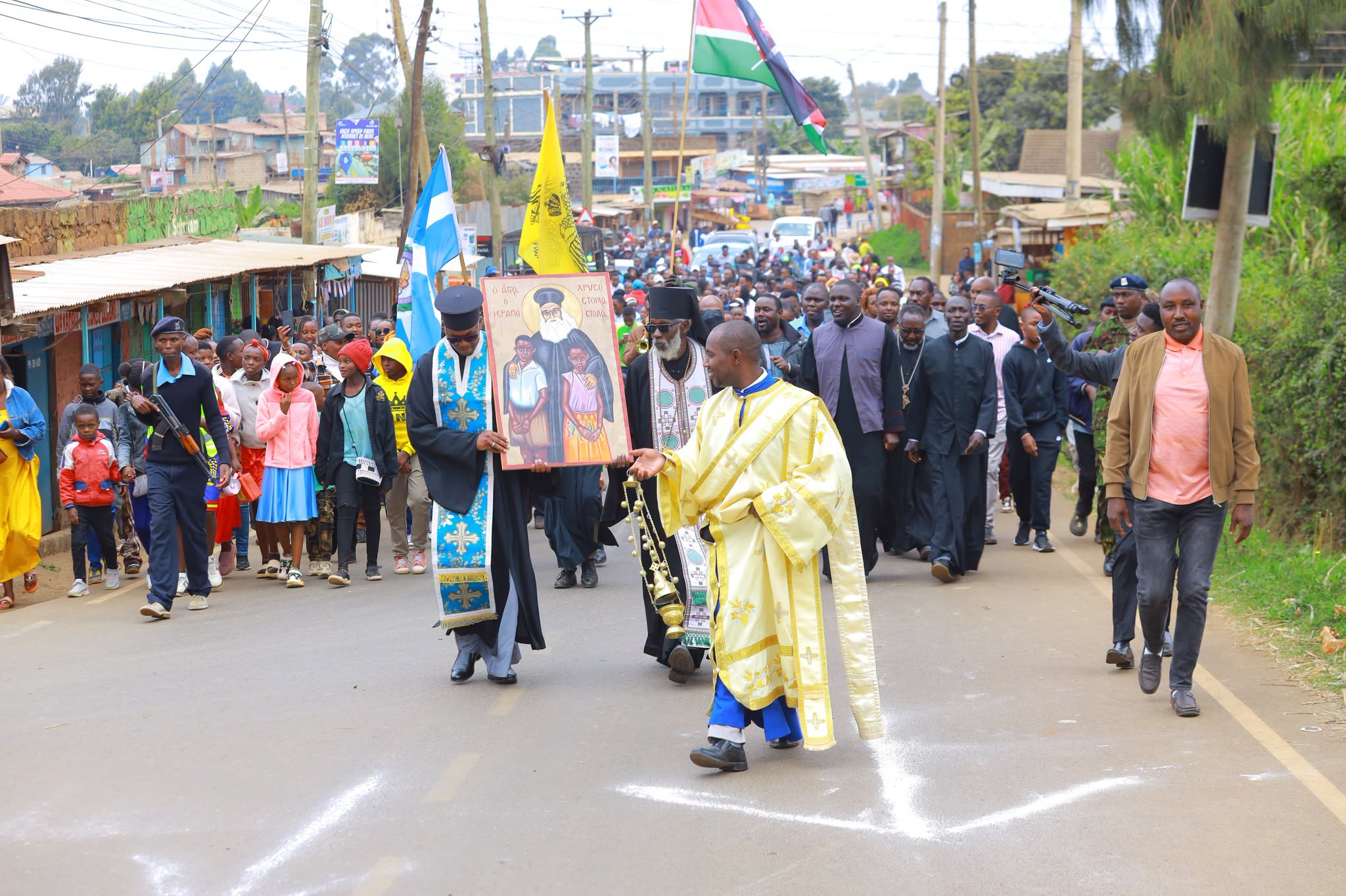 Thousands of christians march wth the icon of St Chrysostomos