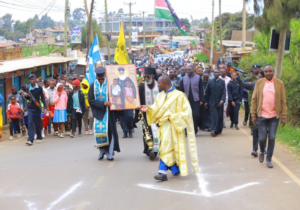 Thousands of christians march wth the icon of St Chrysostomos